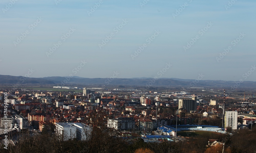 The landscape of the city photographed from the viewpoint, half in the upper part sky blue, in the lower part of the city