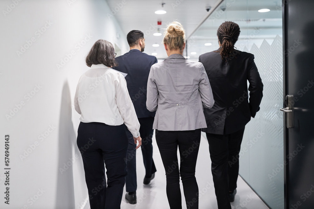 Business team people walk together on the office corridor Business team people walk together on the office corridor