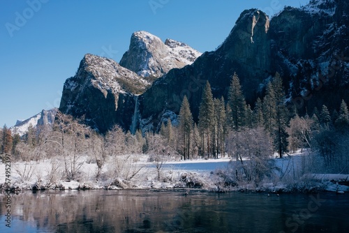River in front of snowy mountains in Yosemite Valley