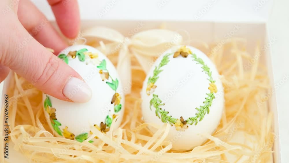 ribbon embroidery on eggshells ribbon embroidery technique on empty egg not chicken eggs turkey or goose eggs technique itself to embroider on eggshells Easter holiday originated in Germany two eggs