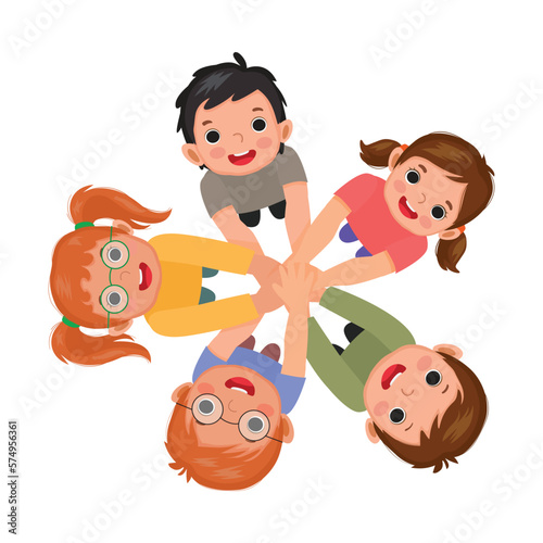 Group of happy kids putting hands together in unity as a team