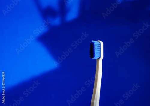 white toothbrush on blue background copy space. the concept of oral hygiene, dental care. Dental concept. health care. Oral hygiene.