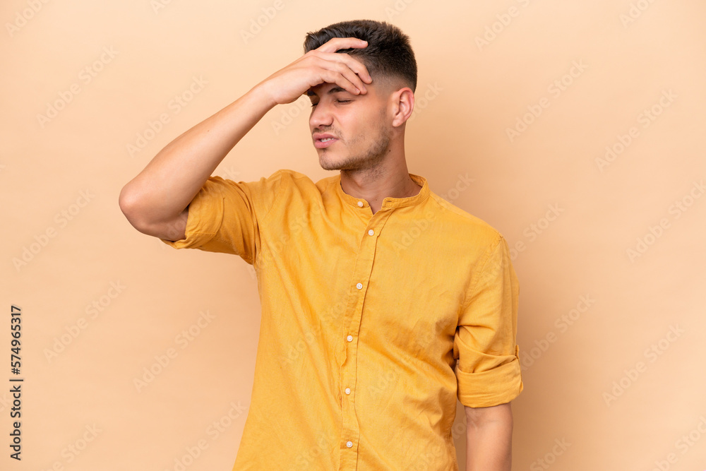 Young caucasian man isolated on beige background with headache Young caucasian man isolated on beige background with headache