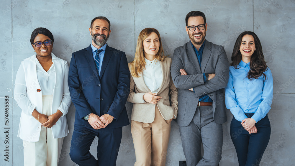 Portrait of multi-ethnic male and female professionals. Business colleagues are standing against wall. They are in formals at office. Confident individuals make a confident team. - obrazy, fototapety, plakaty 