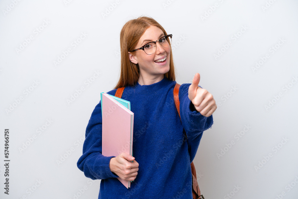 Young student redhead woman isolated on white background with thumbs up because something good has happened Young student redhead woman isolated on white background with thumbs up because something good has happened