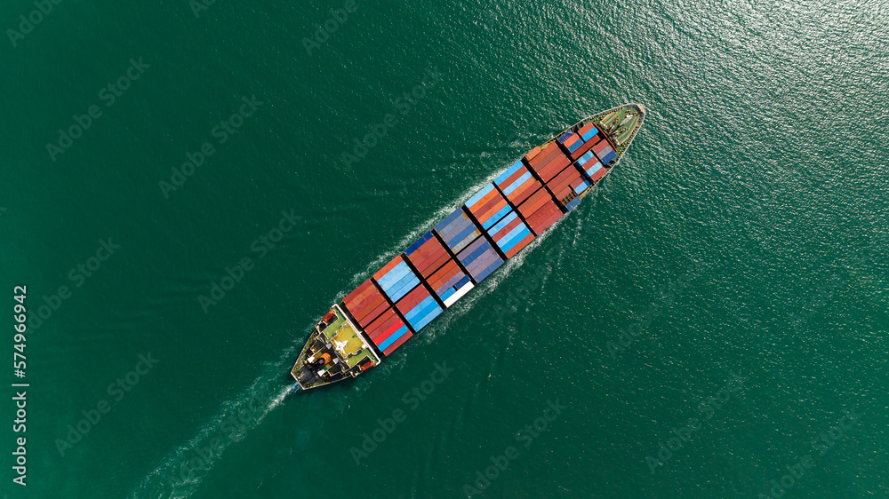 cargo container ship sailing in sea to import export goods and distributing products to dealer and consumers