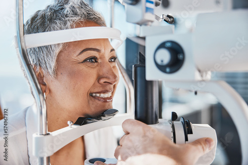 Face, eye exam or happy woman in test or consulting doctor for eyesight assessment at optometrist office. Senior customer testing vision with optician helping or checking iris or retina visual health