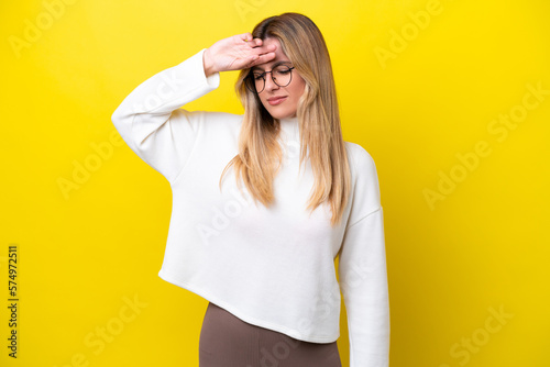 Young Uruguayan woman isolated on yellow background with tired and sick expression