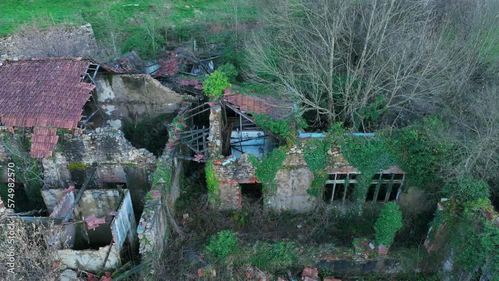 Abandoned buildings of the old Doctor Madrazo Surgical Sanatorium, aerial view from a drone, in the town of Vega de Pas in the Valles Pasiegos. Cantabria, Spain, Europe Abandoned buildings of the old Doctor Madrazo Surgical Sanatorium, aerial view from a drone, in the town of Vega de Pas in the Valles Pasiegos. Cantabria, Spain, Europe
