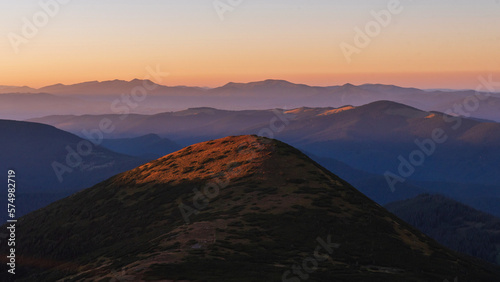 Natural landscape of mountains peaks during sunrise