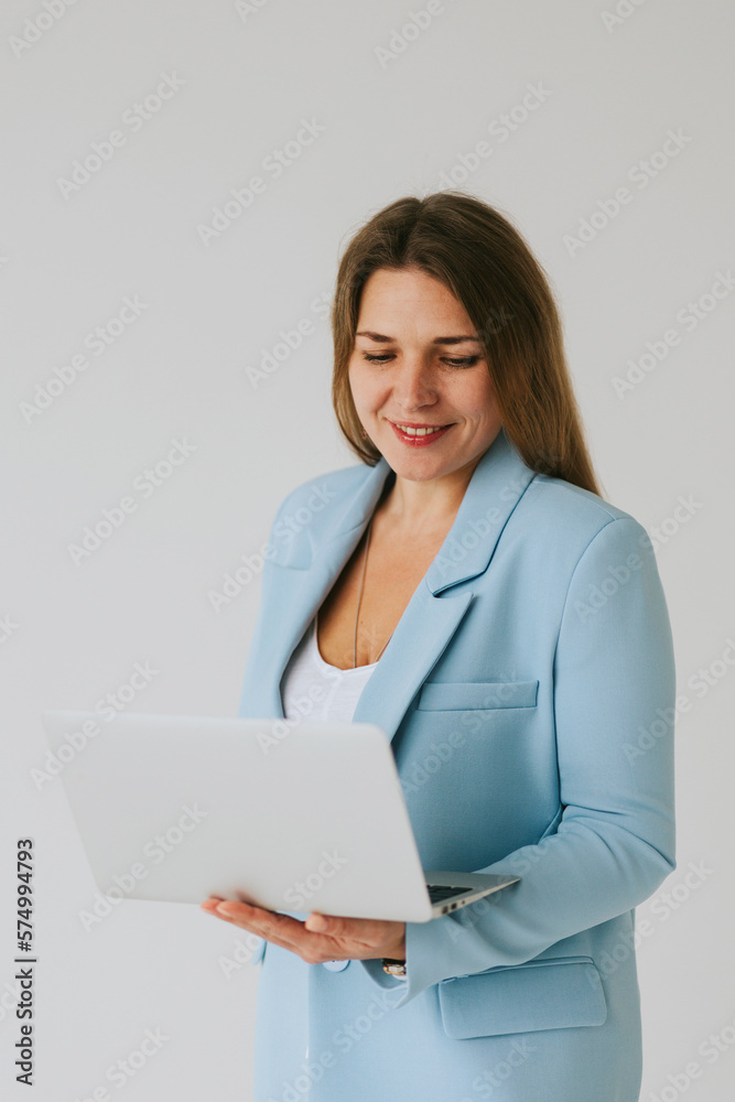 beautiful middle aged real woman portrait with laptop on white background, professional and selfmade businesswoman working online beautiful middle aged real woman portrait with laptop on white background, professional and selfmade businesswoman working online