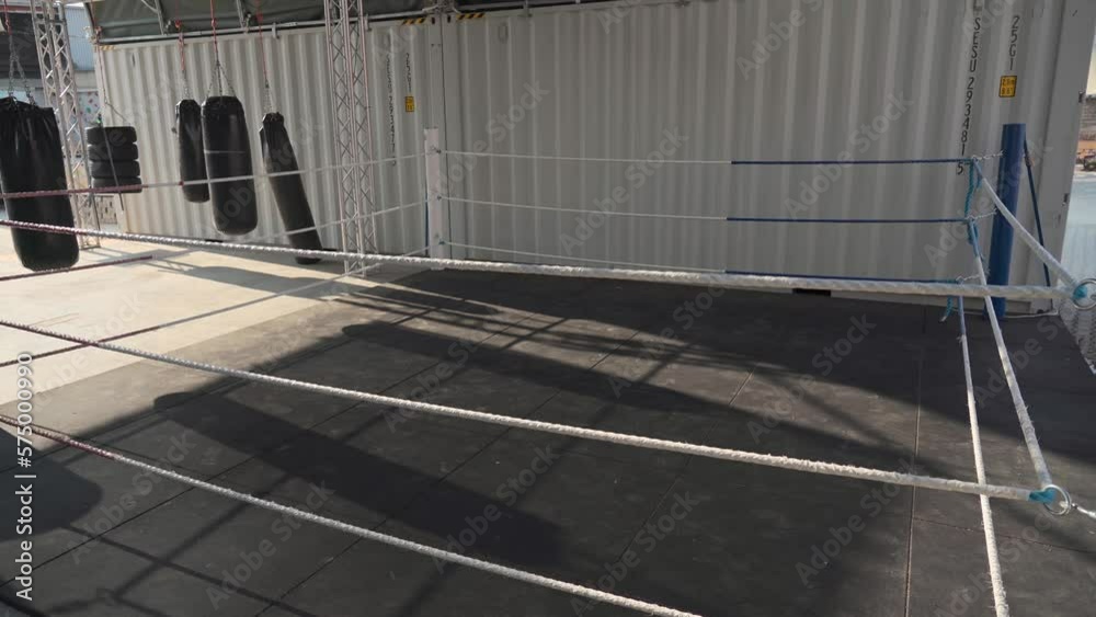 Empty boxing and martial arts area on street gym with many punching