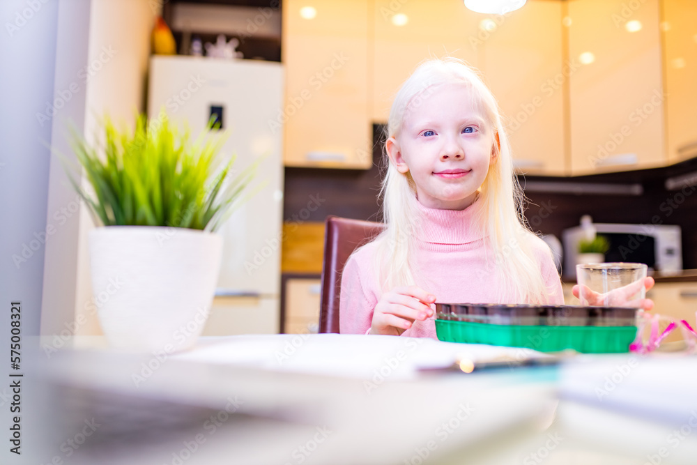 child putting a seed to plant in a seed growing tray at home child putting a seed to plant in a seed growing tray at home