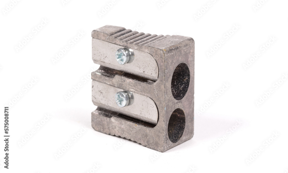 Old manual metal pencil sharpner on white background Old manual metal pencil sharpner on white background