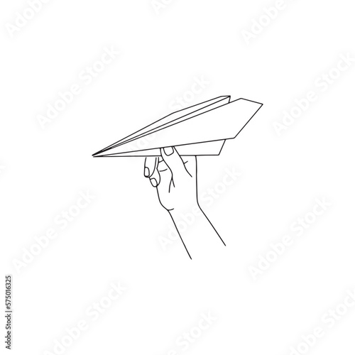 Hand holding a paper airplane. International Civil Aviation Day. Isolated on white background