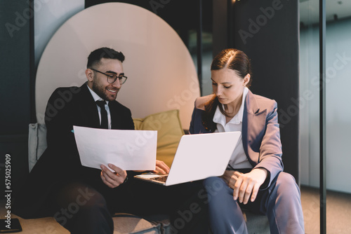 Business people working with documents and laptop in office
