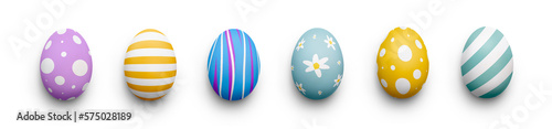 Fotografie A collection of traditional Easter eggs painted in bright colours isolated against a transparent background