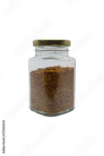 Chili powder in a glass jar with closed lid. Isolated on white with clipping path.