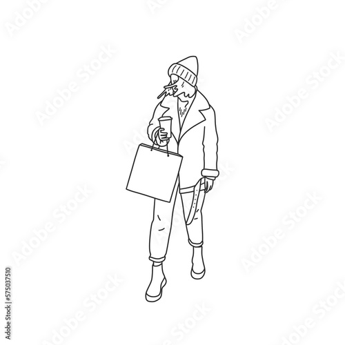 girl in fashionable clothes, in a jacket and hat, with a package in her hands