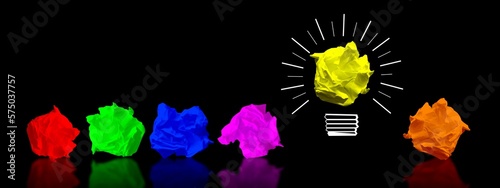 Colorful paperballs light bulbs on black background - idea, creativity concept photo