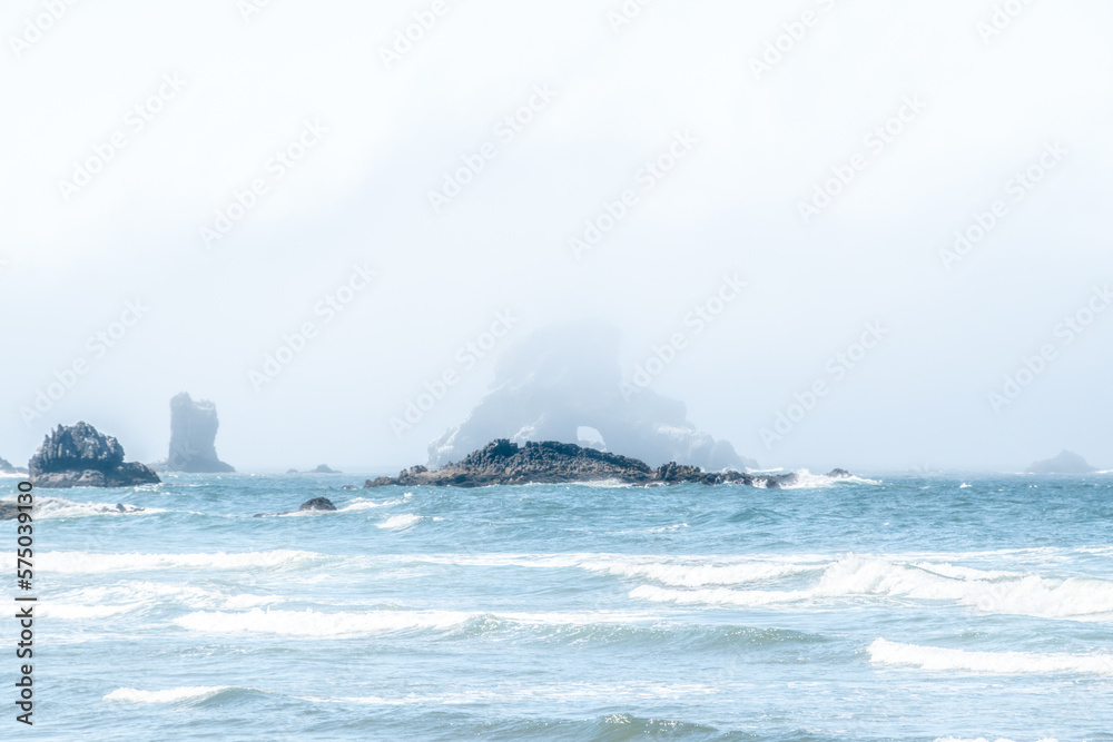 Foggy Summer Day at Indian Beach With Blue Waters Along Oregon Coast With Arch Rock Throuugh the Mist