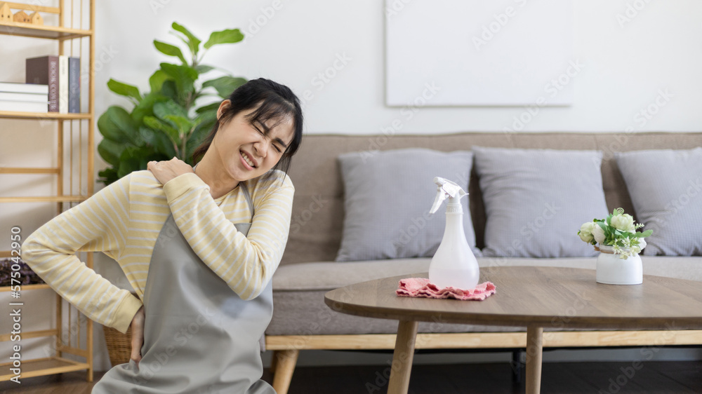 Housewife with back pain and shoulder pain from doing hard housework on weekends, Big cleaning, Housework, Daily routine , Cleaning spray and rags, Spray alcohol, Clean up. Housewife with back pain and shoulder pain from doing hard housework on weekends, Big cleaning, Housework, Daily routine , Cleaning spray and rags, Spray alcohol, Clean up.