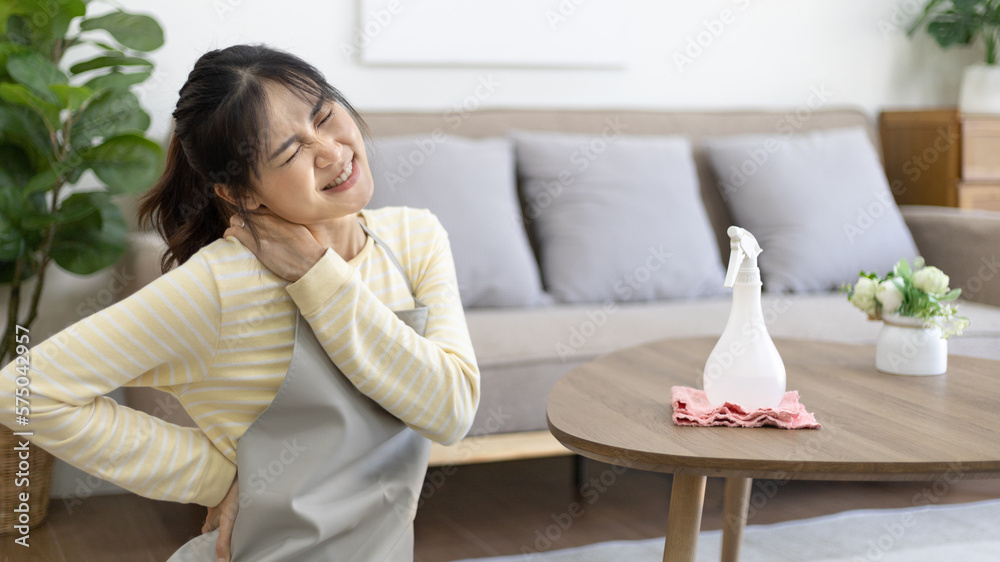 Housewife with back pain and shoulder pain from doing hard housework on weekends, Big cleaning, Housework, Daily routine , Cleaning spray and rags, Spray alcohol, Clean up. Housewife with back pain and shoulder pain from doing hard housework on weekends, Big cleaning, Housework, Daily routine , Cleaning spray and rags, Spray alcohol, Clean up.