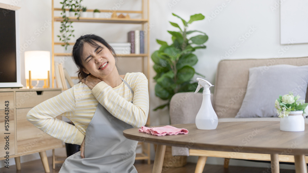 Housewife with back pain and shoulder pain from doing hard housework on weekends, Big cleaning, Housework, Daily routine , Cleaning spray and rags, Spray alcohol, Clean up. Housewife with back pain and shoulder pain from doing hard housework on weekends, Big cleaning, Housework, Daily routine , Cleaning spray and rags, Spray alcohol, Clean up.
