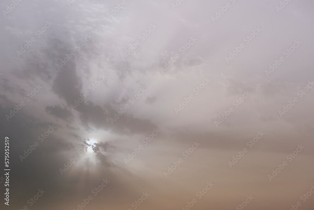 Fototapeta premium A sky, with diffused sun, clouds, colourful,