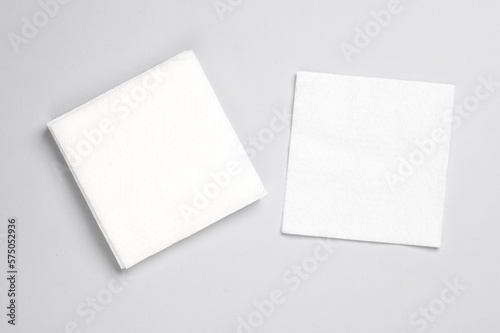 White paper napkins on gray background. Top view