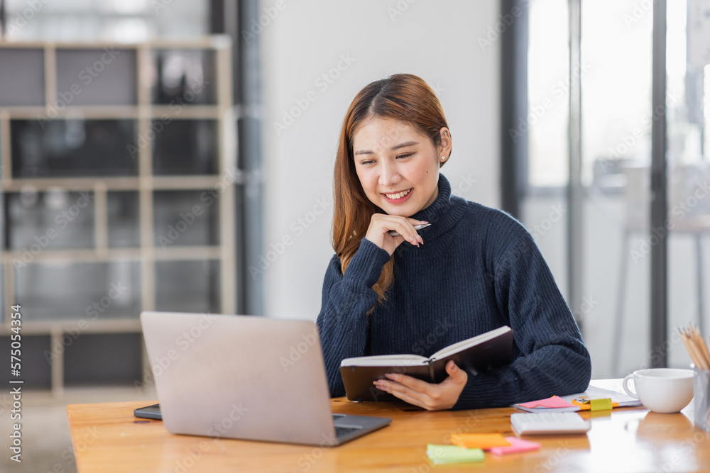Asian Business woman using calculator and laptop for doing math finance on an office desk, tax, report, accounting, statistics, and analytical research concept
Asian Business woman using calculator and laptop for doing math finance on an office desk, tax, report, accounting, statistics, and analytical research concept