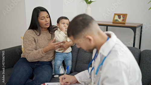Couple and son having medical consultation at clinic