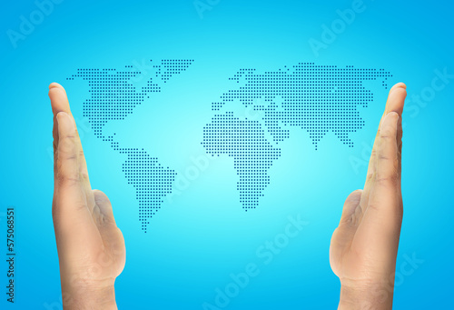 dotted worldmap among the hands over a cian background