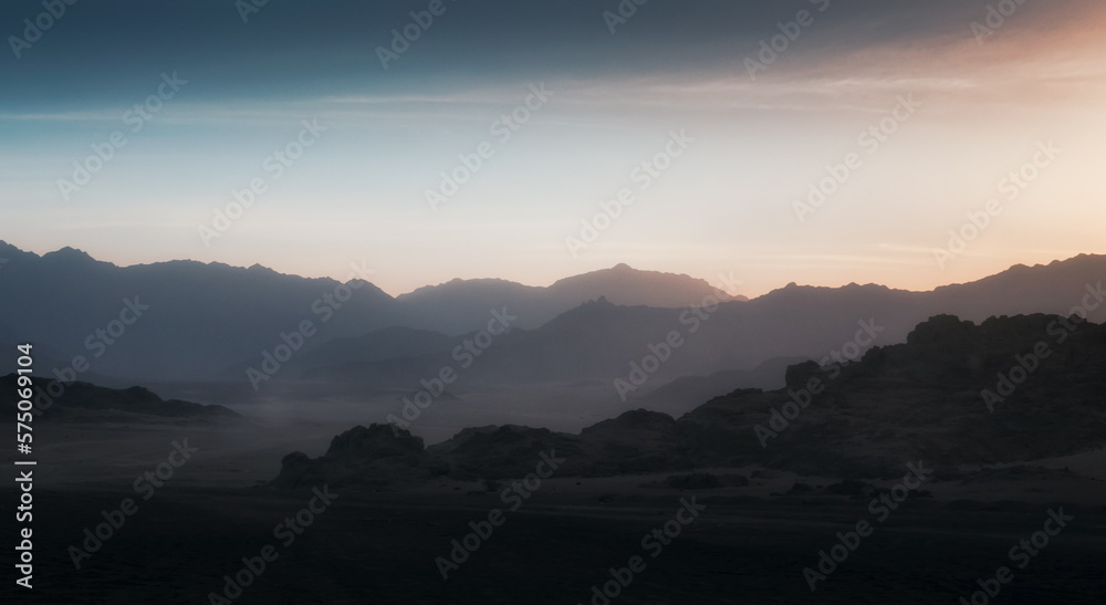 peaks of mountains in the desert of egypt against sunset
