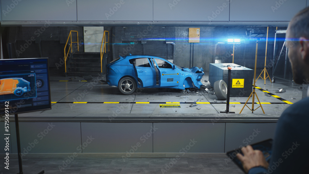 Male engineer simulates and watches process of traffic accident using ...