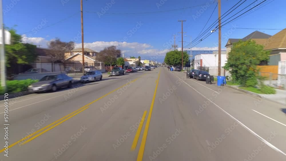 Aerial: Pov From A Car Driving Through A Bustling Residential Neighborhood On A Sunny Day - Los Angeles, California Aerial: Pov From A Car Driving Through A Bustling Residential Neighborhood On A Sunny Day - Los Angeles, California