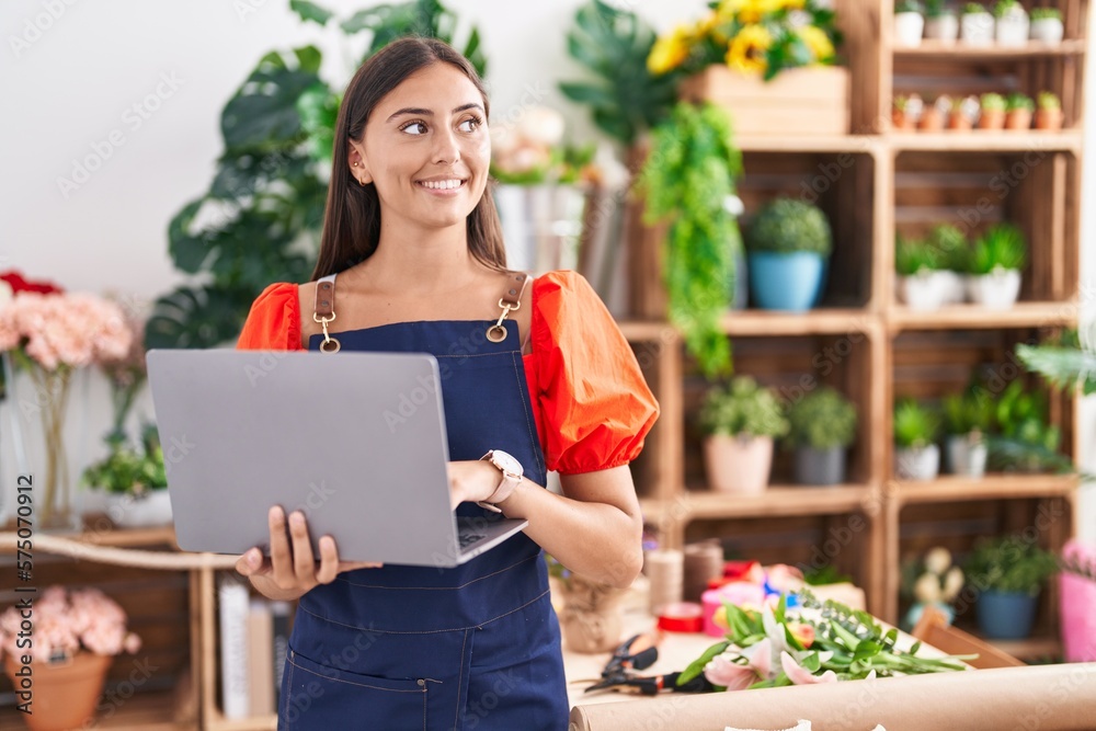 Young beautiful hispanic woman florist smiling confident using laptop at florist Young beautiful hispanic woman florist smiling confident using laptop at florist