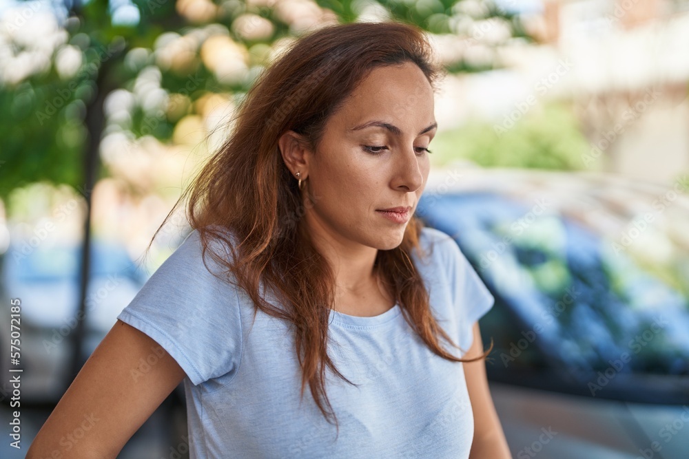 Young woman standing with worried expression at street Young woman standing with worried expression at street
