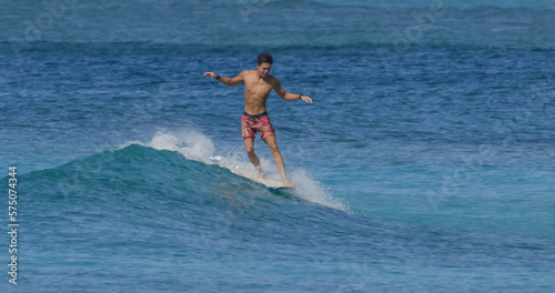 Photography Young man surfer surfing ocean waves