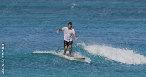 Man surfer surfing ocean waves