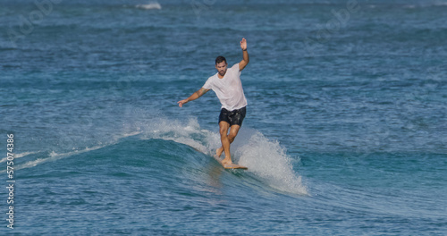 Man surfer surfing ocean waves © blvdone