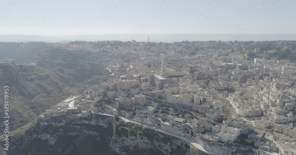 Aerial view of Matera 4K. Flying around the ancient city in Italy. White and old buildings remember Jerusalem. View of Murzia Materana and the paleolithic caves. Panoramic flying. Aerial view of Matera 4K. Flying around the ancient city in Italy. White and old buildings remember Jerusalem. View of Murzia Materana and the paleolithic caves. Panoramic flying.