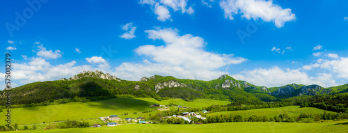 Panorama of rocks mountain emerging from forest around valley in landscape © Petr Belosicky foto