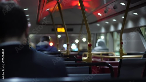 Wallpaper Mural Back of bus interior at night in movement. Inside British public transportation ceiling with light reflection. Passengers seated inside bus Torontodigital.ca