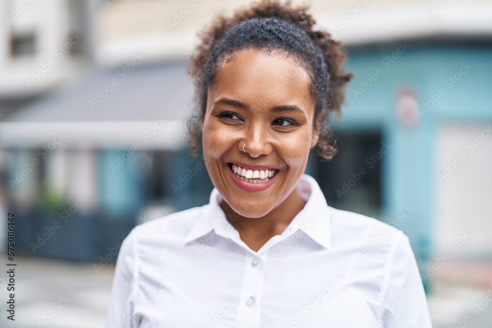 African american woman smiling confident looking to the side at street African american woman smiling confident looking to the side at street