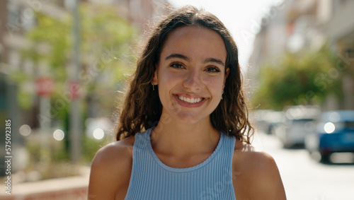 Young beautiful hispanic woman smiling confident standing at street Free Download Young beautiful hispanic woman smiling confident standing at street - GFXLoad