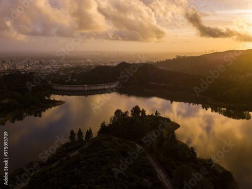 High-angle views taken from a drone of Lake Hollywood, or Hollywood Reservoir, in the Hollywood neighborhood of Los Angeles, California. Pictures taken after a large rainfall showing the lush foliage.