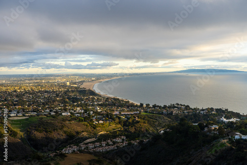 Sunset views from the Santa Monica Mountains while hiking, looking down on the city of Los Angeles and the Santa Monica Bay. © Adam