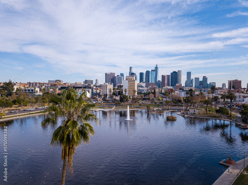 Aerial views of MacArthur Park in Los Angeles, California. High angle photos taken with a drone showing the MacArthur park lake and downtown Los Angeles behind it.