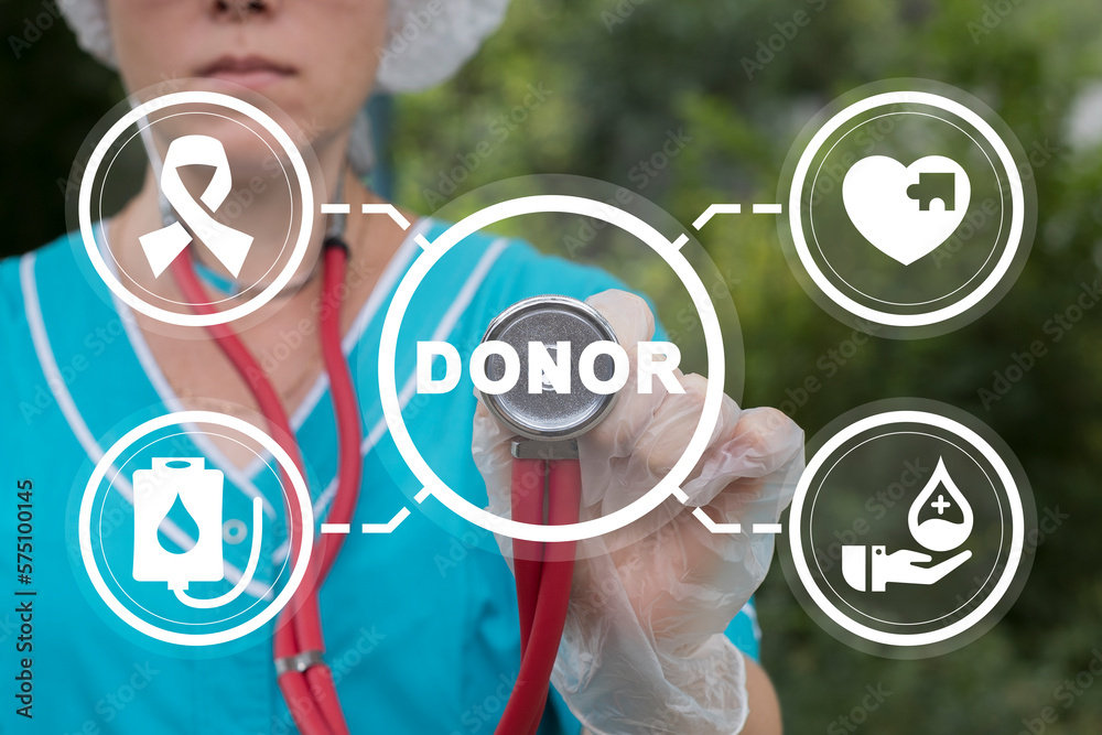 Doctor using virtual touch screen presses word: DONOR. Blood donation. Concept of blood and plasma donating. Blood transfusion. World blood donor day. Doctor using virtual touch screen presses word: DONOR. Blood donation. Concept of blood and plasma donating. Blood transfusion. World blood donor day.